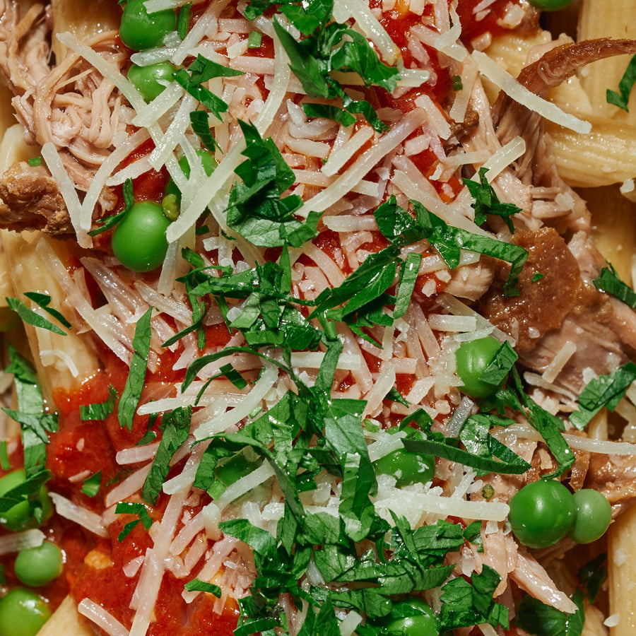 Slow Cooked Pasture Fed Lamb with Peas, Chilli, Tomato Ragu & Parmesan Cheese