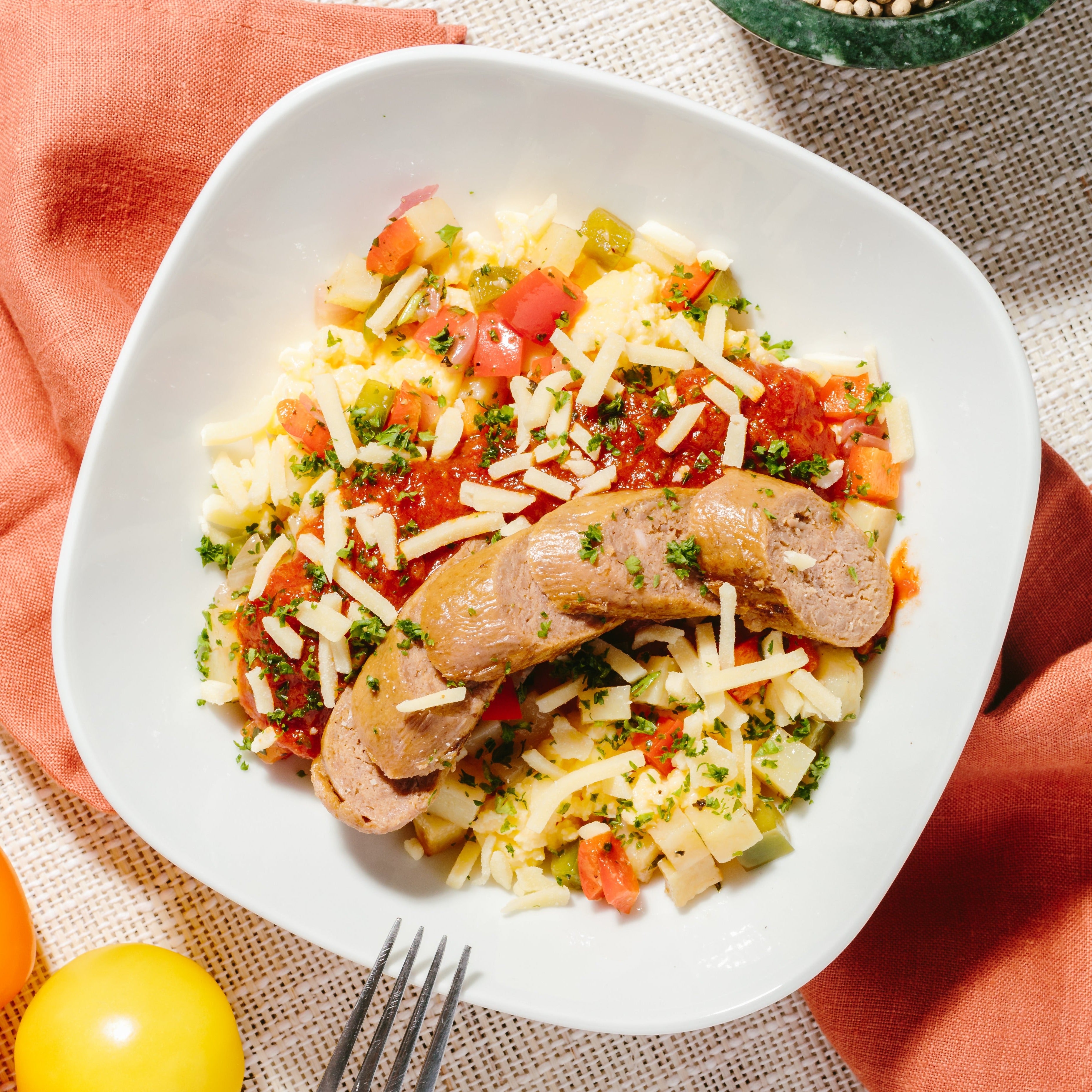 Country Breakfast Bowl with Plant-Based Sausage, Roasted Potato Hash, Scrambled Eggs, Tomato Fondue Cheddar Cheese