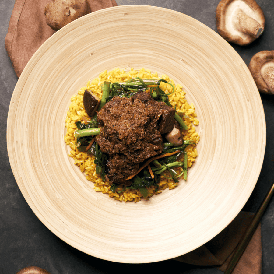 Padang Beef Rendang with Morning Glory, Shiitake Mushrooms, Shredded Carrots & Turmeric Rice