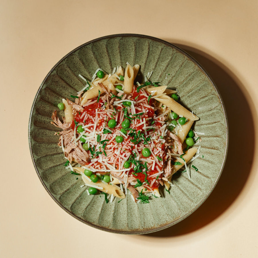 Plant-Based Pork Strips Ragu with Peas, Parmesan & Whole Wheat Penne