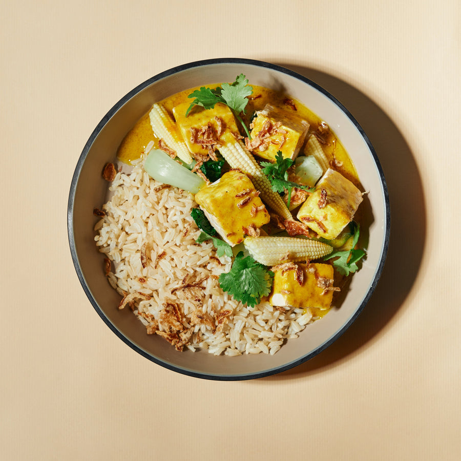 Tempeh in Lite Coconut Yellow Curry Sauce with Steamed Greens, Baby Corn & Steamed Brown Rice