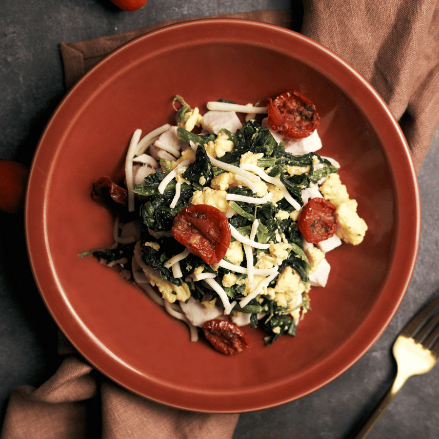 High Protein Scrambled Eggs Florentine with Plant-Based Chicken, Creamed Spinach & Oven Dried Cherry Tomato