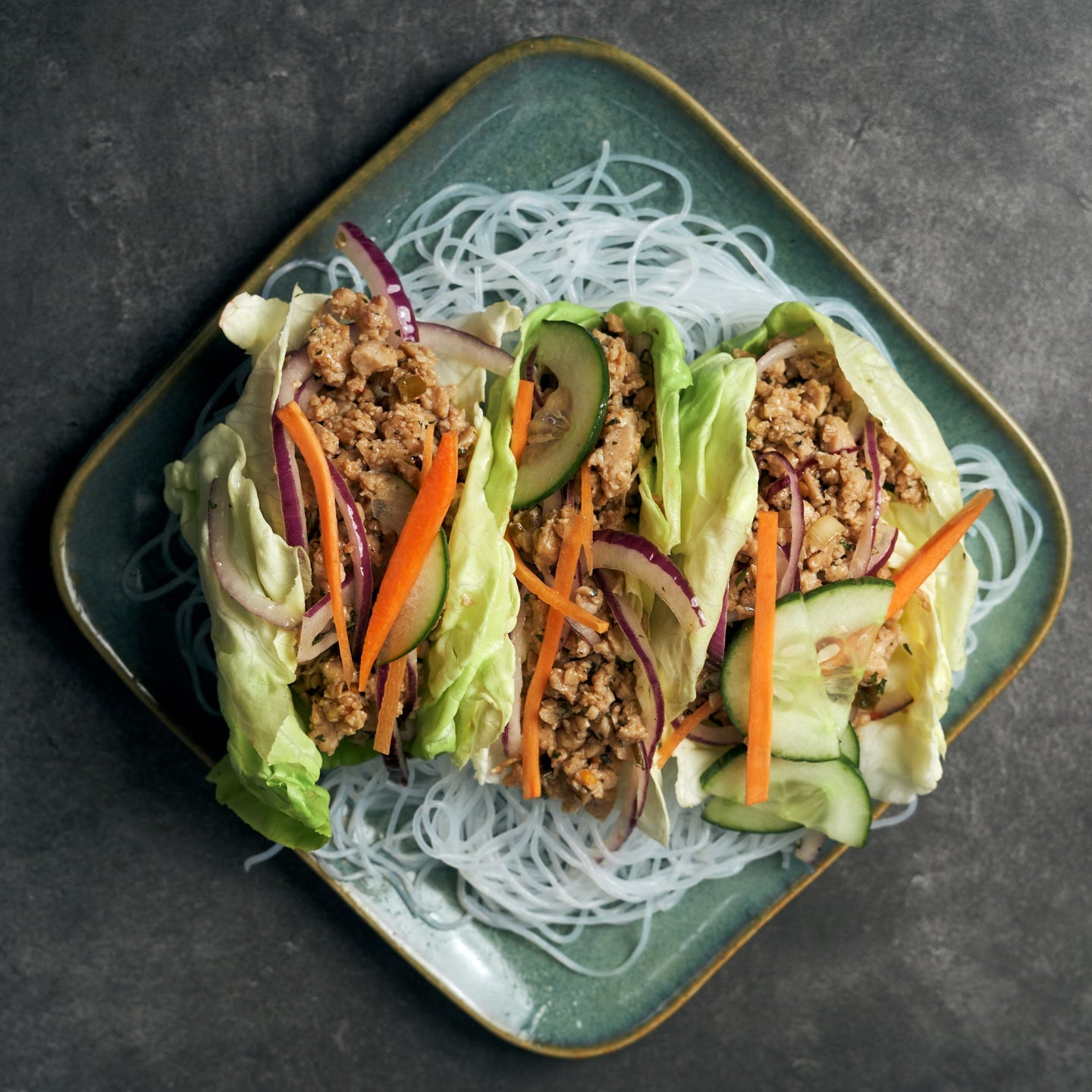Healthy Plant-Based Pork Larb Salad with Shredded Carrots, Sliced Cucumber, Larb Dressing & Glass Vermicelli