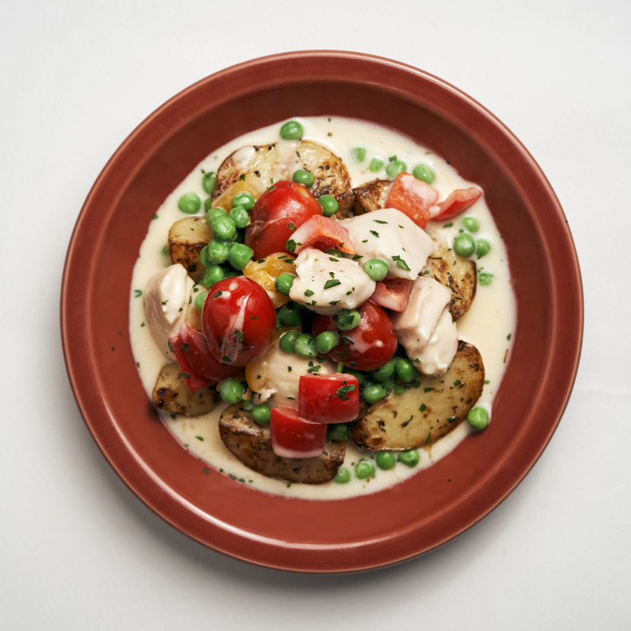 Plant-Based Chicken Mornay with Assorted Bell Peppers, Green Peas, Cherry Tomatoes & Roasted Potatoes