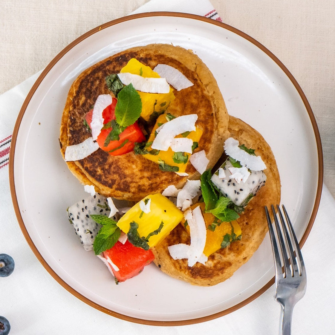Coconut Protein Pancakes with Tropical Fruit Salad
