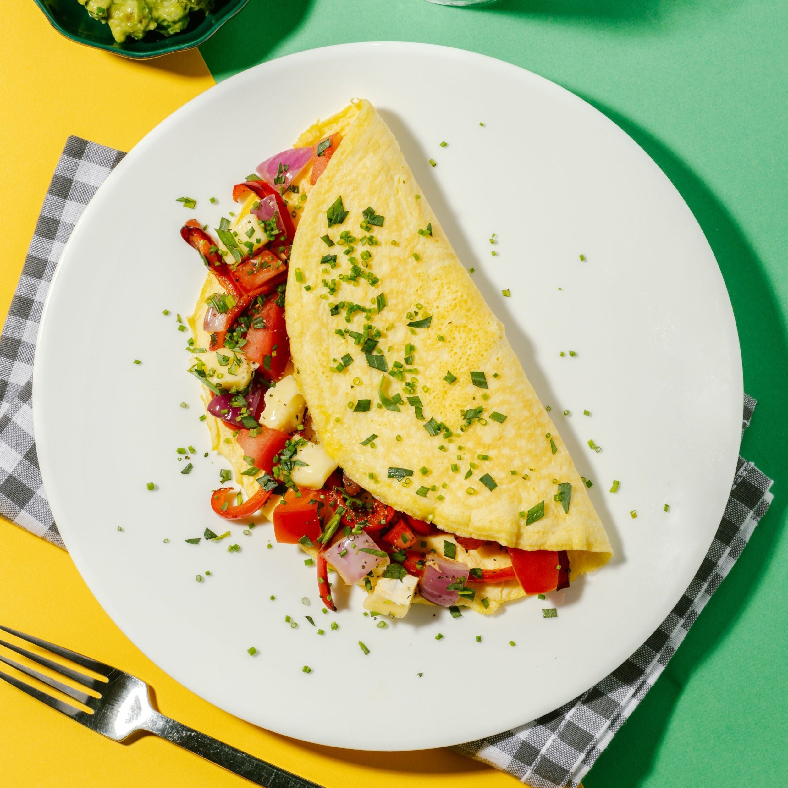 Cheese Omelette with Roasted Peppers, Tomato, Red Onion & Tarragon