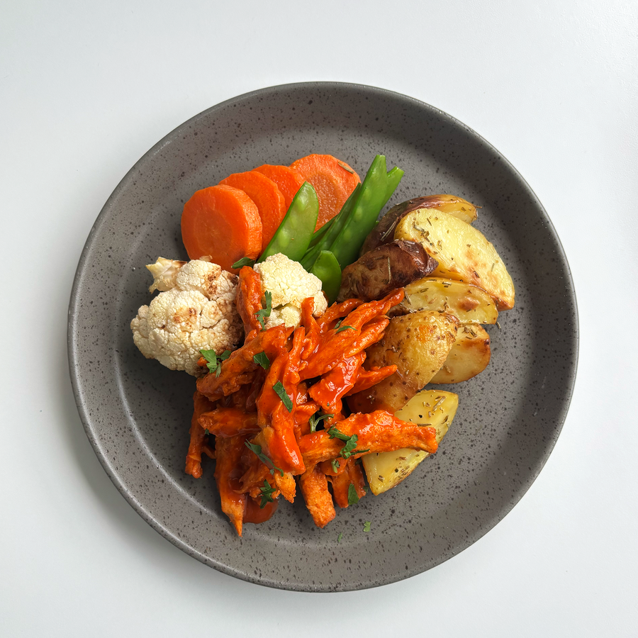 Buffalo Plant-Based Chicken with Roasted Cauliflower, Carrots, Snow Peas, Blue Cheese Buttermilk Dressing & Roasted Rosemary Potatoes