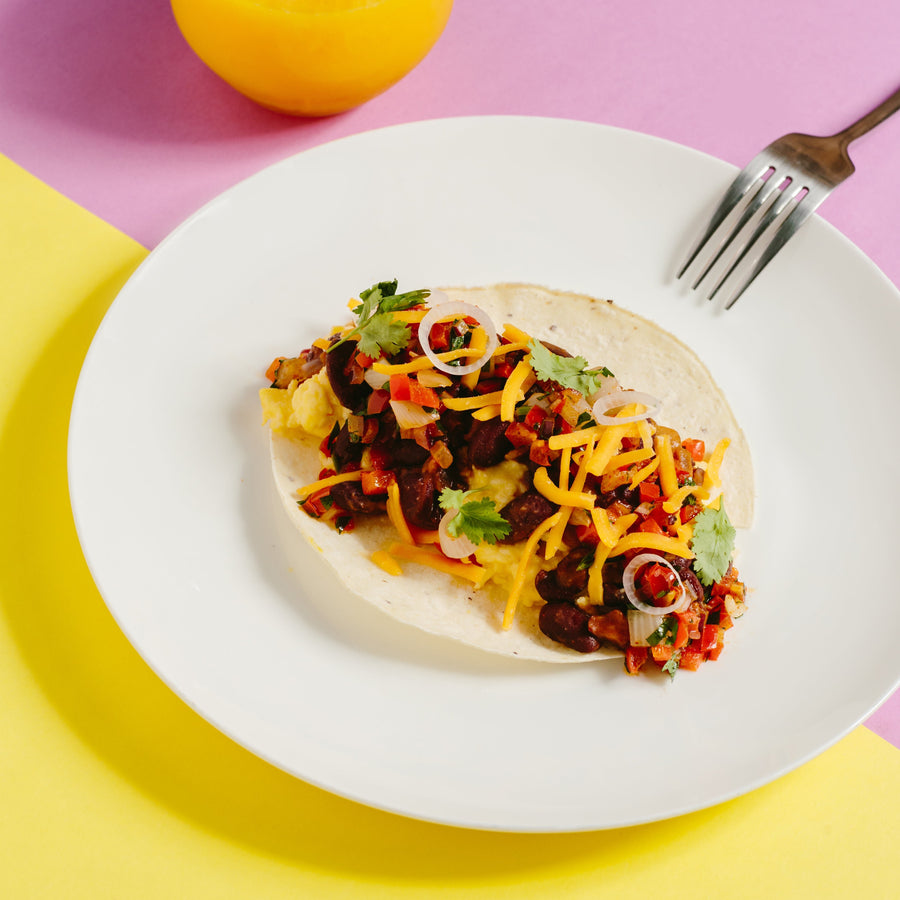 Mixed Bean Breakfast Burrito with Scrambled Eggs, Roasted Red Pepper Salsa, Cheddar Cheese, Pickled Shallots