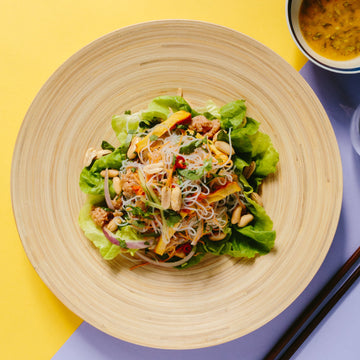 Thai Glass Noodle Salad with Cucumber, Carrots, Toasted Peanuts, Crispy Tofu & Ginger Lime Dressing